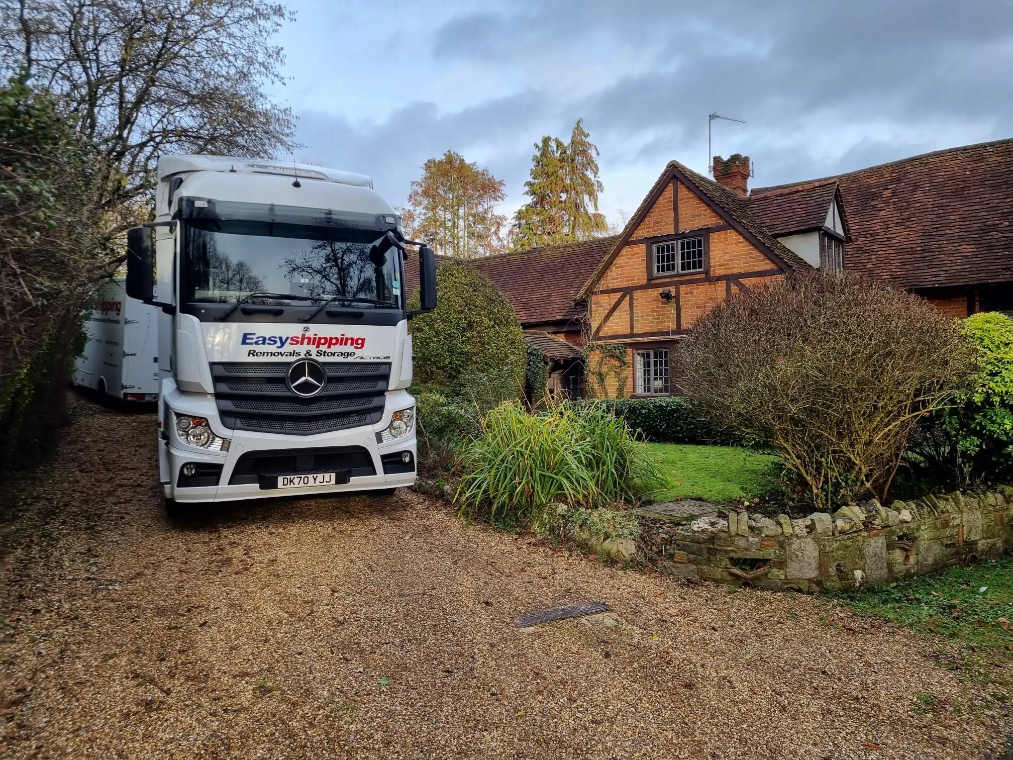 Truck parked by a house entrance.